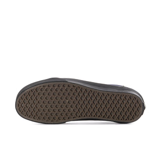 Textured rubber outsole of men's sneakers in dark brown
