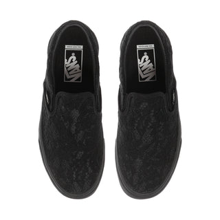 Women's black slip-on sneaker with Vans logos on the tongue
