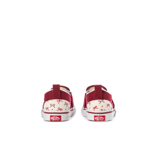 Toddler slip-on sneakers, back view: bordeaux heel with white bow print panels