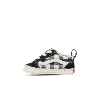 Infant black-and-white buffalo plaid slip-on crib shoe with rear pull tab