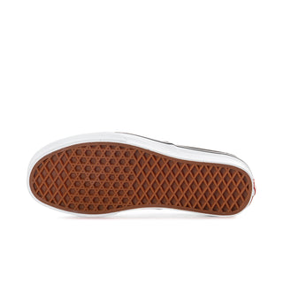 Women's sneaker outsole view with brown rubber tread and white edge