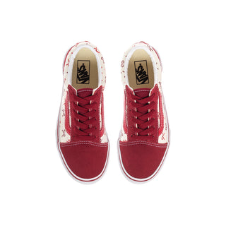 Top view of kids' Old Skool V sneakers with burgundy laces, bow print panels, and white lining