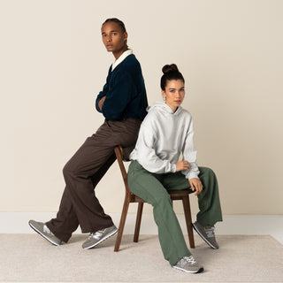 Women’s New Balance 574 sneakers, grey-and-white lace-up shoes worn with pants
