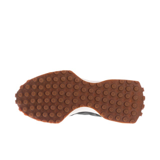Women’s New Balance outsole tread view with brown rubber and white midfoot edge