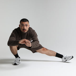 Men's brown knit shorts, side view with elastic waistband