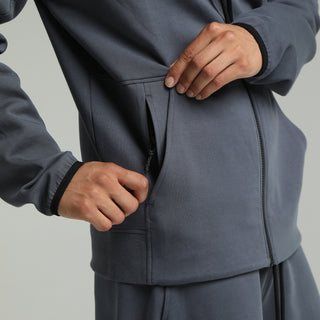 Men's dark blue zip hoody detail: front zipper and pocket, drawcord