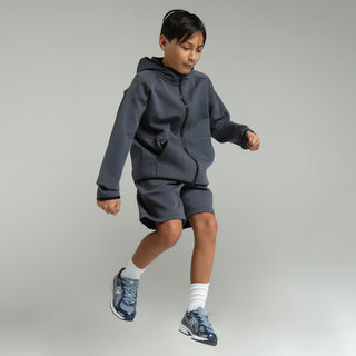 Youth dark blue athletic shorts, above-knee length with elastic waist