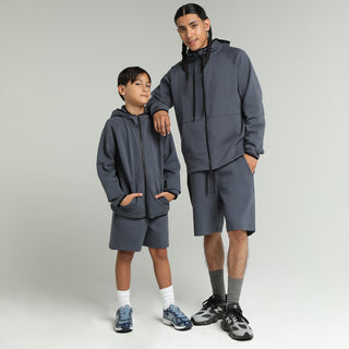 Youth dark blue shorts with elastic waist and above-knee length