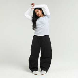 Women's black barrel pants with wide legs and gathered drawstring waist