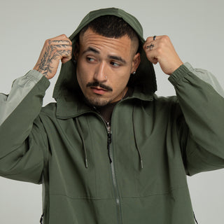 Men's olive windbreaker jacket with attached hood and zippered chest opening
