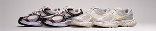 Two pairs of Nike running shoes in black, silver, and white on a light gray background.