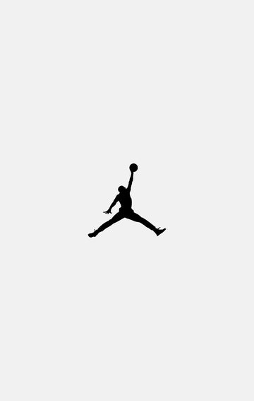 Black silhouette of a person jumping with a basketball on a white background