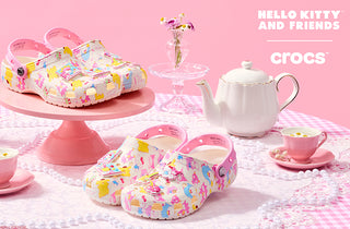 Colorful Crocs shoes with a tea set on a pink background, featuring Hello Kitty and Friends branding.