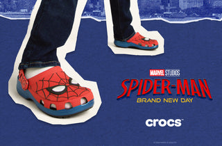 Child wearing Spider-Man Crocs featuring a red web design inspired by Marvel's Spider-Man: Brand New Day