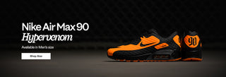 Black and orange Nike Air Max 90 Hyper Venom sneaker on a dark background