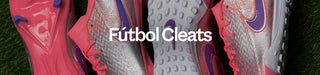 Close-up of pink and purple soccer cleats with 'Fõtbol Cleats' text on a grass background