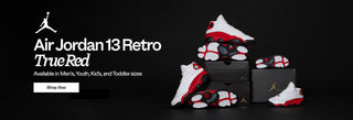 Air Jordan 13 Retro True Red sneakers displayed with packaging on a black background