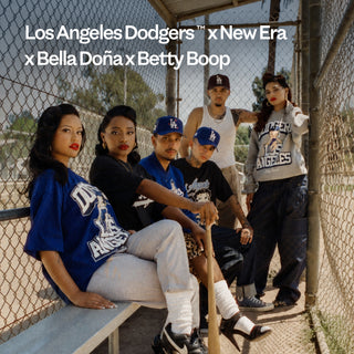 Models in a baseball dugout wearing Los Angeles Dodgers x New Era x Bella Doña x Betty Boop apparel and caps.